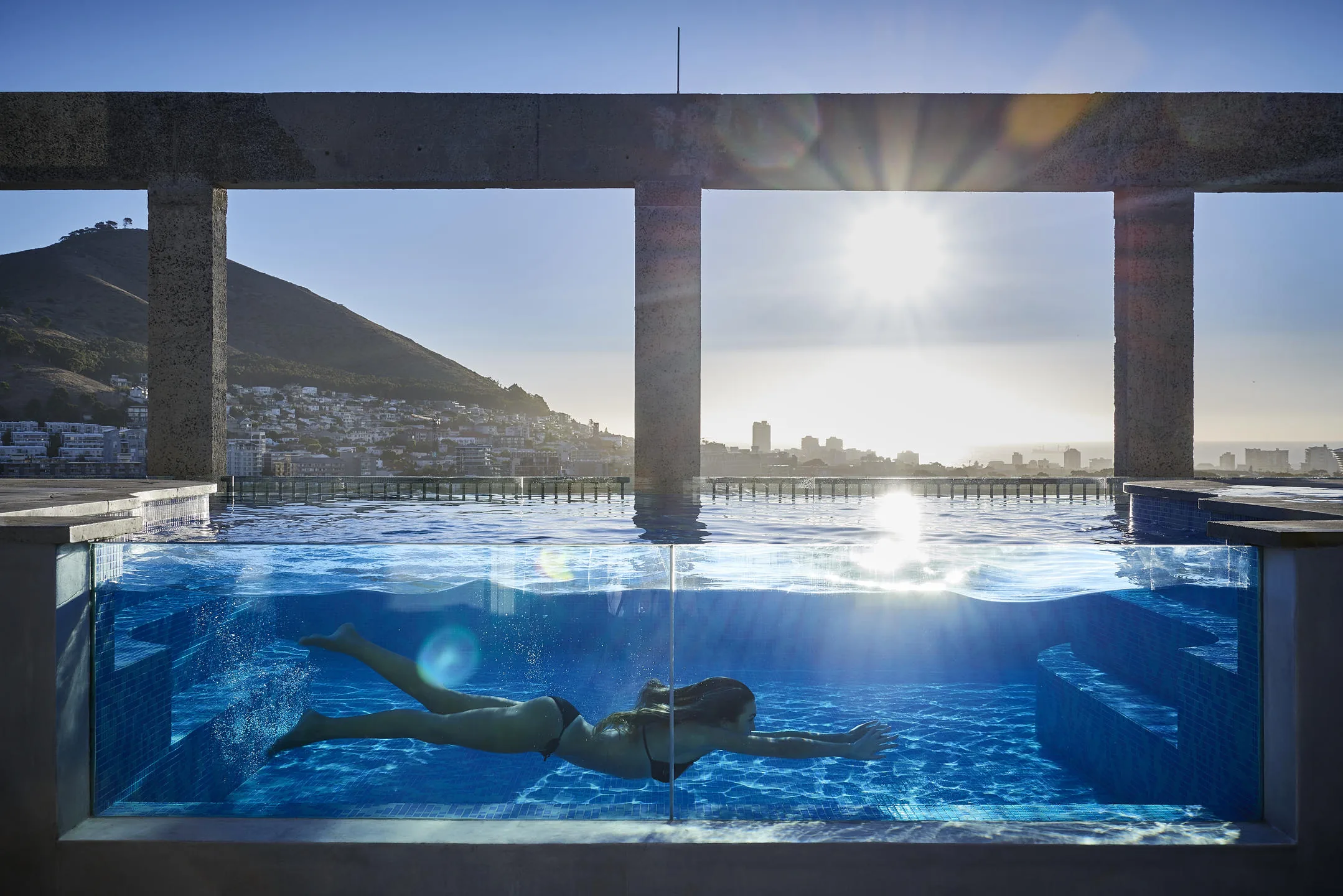 The Silo rooftop pool and Table Mountain at sunset