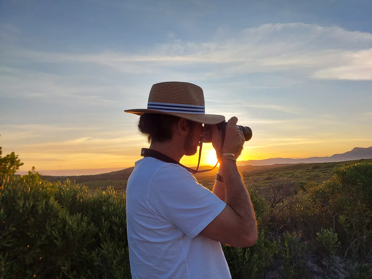 Mikhail photographing a landscape in the warm evening light