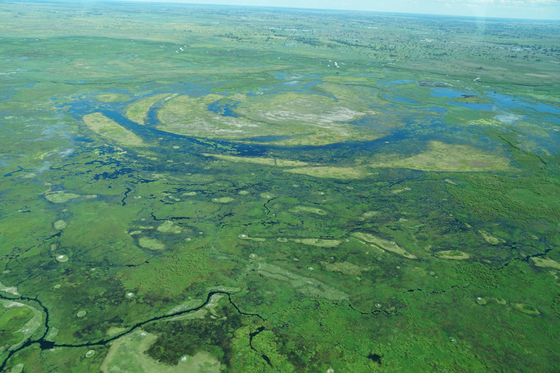 Aerial view of winding waterways and floodplains in Botswana's Okavango Delta